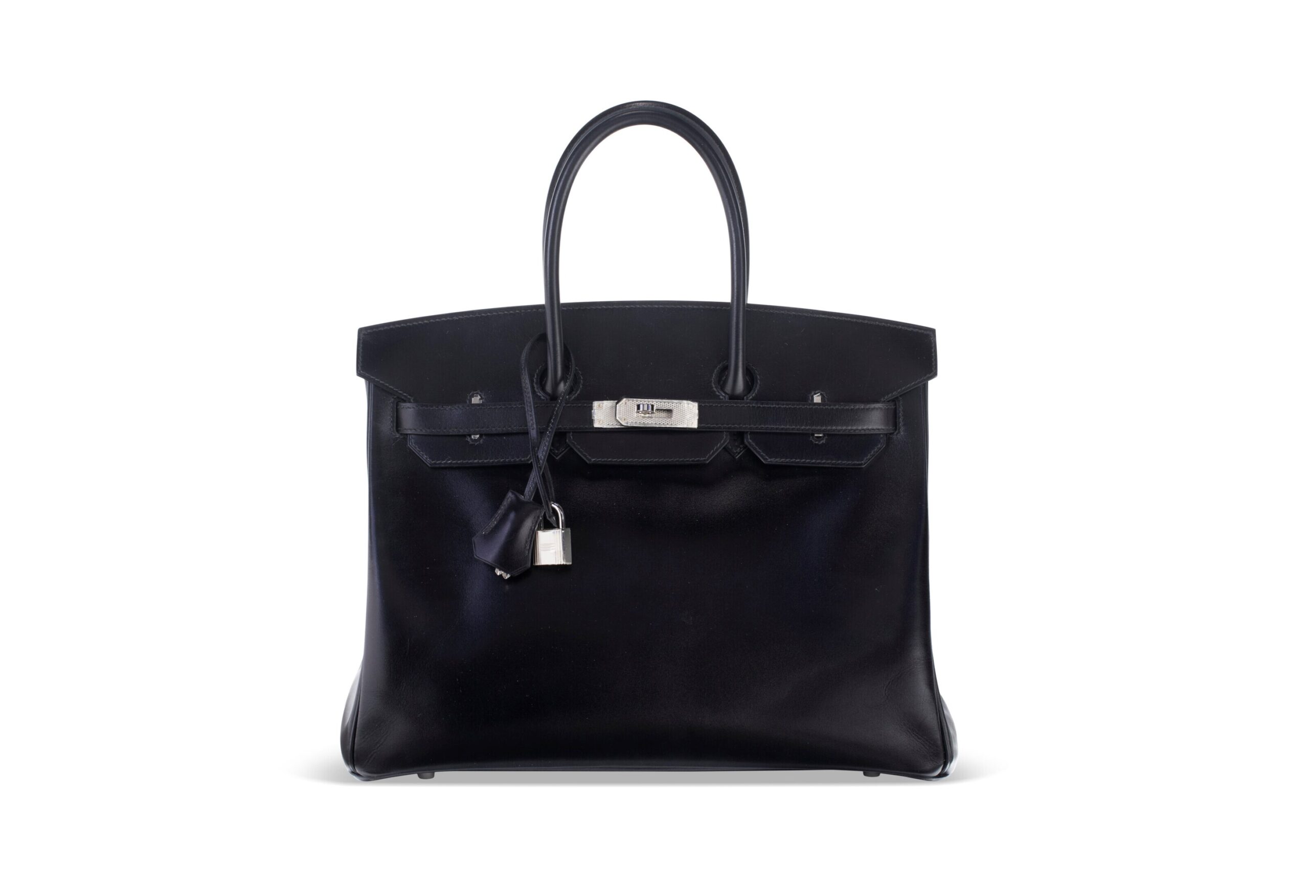 A LIMITED EDITION BLACK CALF BOX LEATHER BIRKIN 35 WITH GUILLOCHÉ PALLADIUM HARDWARE 1 A LIMITED EDITION BLACK CALF BOX LEATHER BIRKIN 35 WITH GUILLOCHÉ PALLADIUM HARDWARE